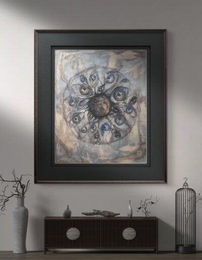 Obra en acrilico¨Karmageddon¨enmarcada. Pintura acrilica en tonos fríos y texturas etéreas que representa un núcleo oscuro rodeado por múltiples ojos interconectados. La obra evoca la vigilancia, la conciencia colectiva y la dualidad entre luz y sombra, reflejando una visión crítica de la sociedad. Inspirada en la canción 'Karmageddon', transmite un mensaje sobre el ciclo ineludible de las acciones humanas y su retorno.